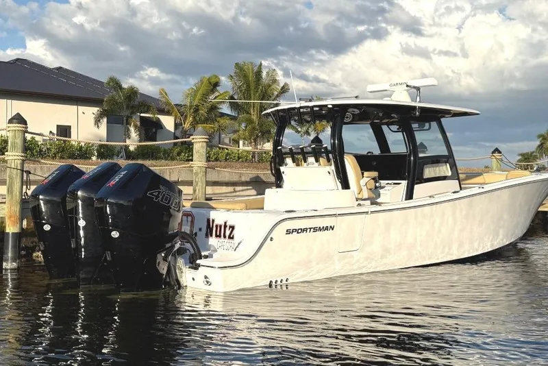 Slide: The Image of 2025 Sportsman Open 352 Center Console boat docked, featuring triple 400R engines. - 5