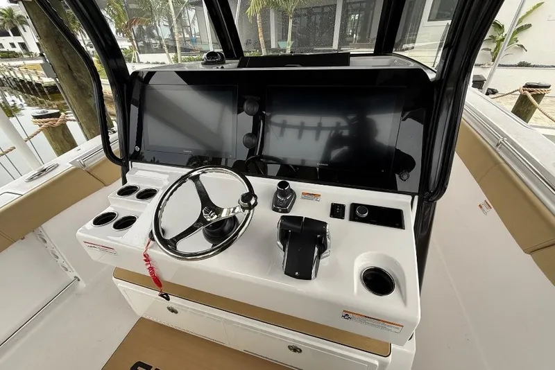 Slide: The Image of 2025 Sportsman Open 352 Center Console boat docked, showcasing sleek design and modern features. - 7