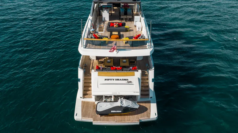 Slide: The Image of 2018 Sanlorenzo SL106 yacht on open water, featuring spacious deck and luxury amenities. - 12