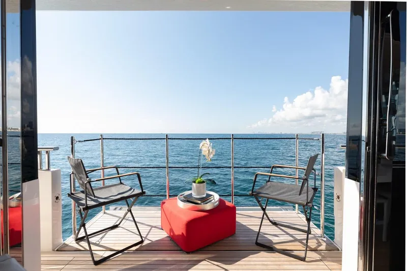 Slide: The Image of Luxury Sanlorenzo SL106 yacht deck with chairs, table, and ocean view, 2018 model. - 19