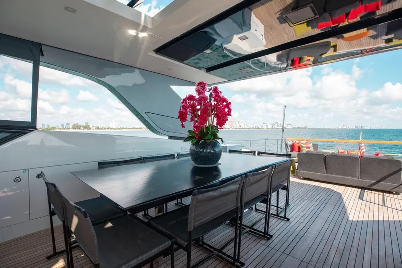 Slide: The Image of Luxurious 2018 Sanlorenzo SL106 yacht deck with dining area and ocean view. - 21