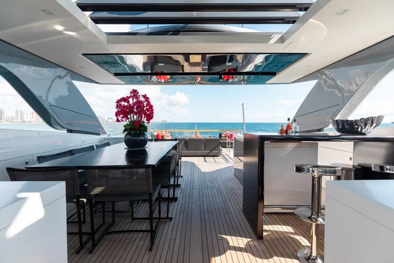 Slide: The Image of Luxurious 2018 Sanlorenzo SL106 yacht deck with dining area and ocean view. - 22
