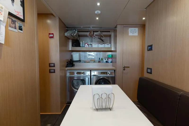 Slide: The Image of Laundry area inside 2018 Sanlorenzo SL106 yacht with modern appliances and wooden interior. - 45