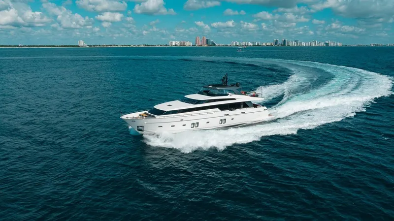 Slide: The Image of Sanlorenzo SL106 yacht cruising on open water, 2018 model, under a clear blue sky. - 6