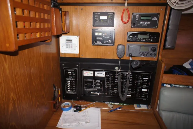 Slide: The Image of Control panel of a 2004 Catalina 350 sailboat with navigation and communication equipment. - 4