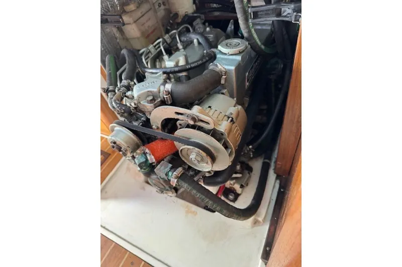 Slide: The Image of Engine of a 2004 Catalina 350 sailboat, showcasing mechanical components. - 9