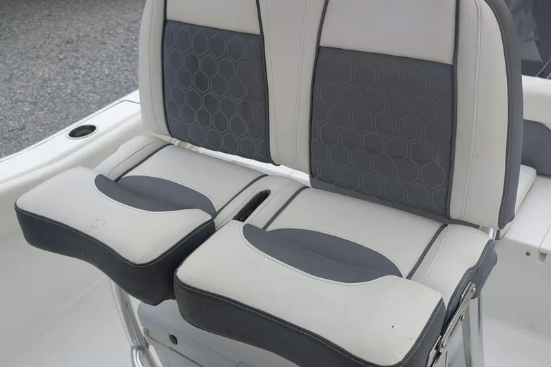 Slide: The Image of 2017 Tidewater 210 LXF boat seats with gray and white upholstery. - 10