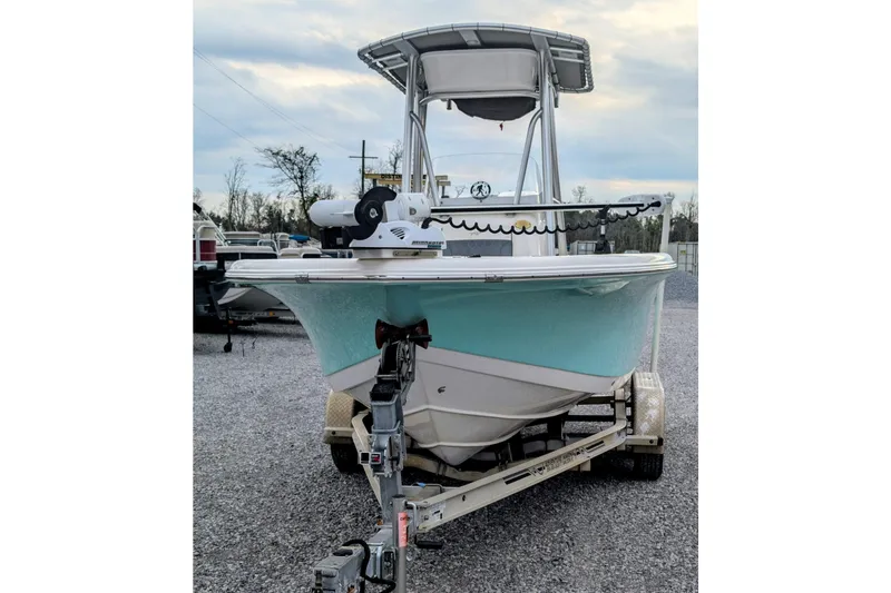 Slide: The Image of 2017 Tidewater 210 LXF boat on trailer, front view, light blue hull. - 2
