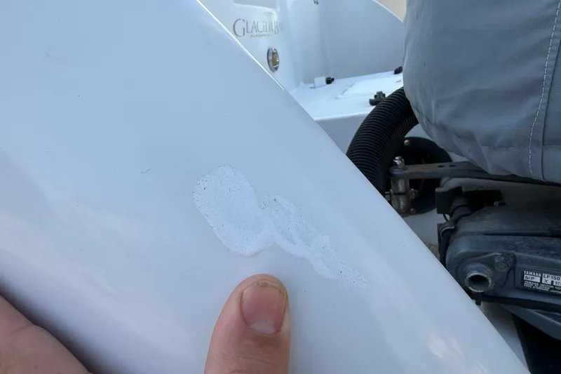 Slide: The Image of Close-up of a 2005 Glacier Bay 2680 Coastal Runner boat with a small scratch. - 10