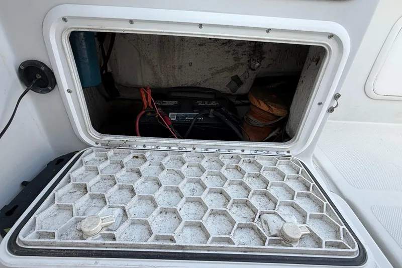 Slide: The Image of Open hatch of 2005 Glacier Bay 2680 Coastal Runner showing battery compartment. - 19