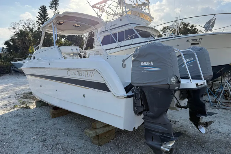 Slide: The Image of 2005 Glacier Bay 2680 Coastal Runner boat with Yamaha engines on dry dock. - 3