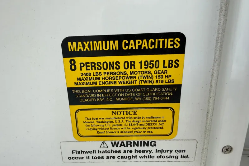 Slide: The Image of 2005 Glacier Bay 2680 Coastal Runner capacity label, max 8 persons or 1950 lbs, safety warning. - 39