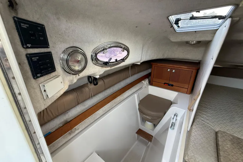 Slide: The Image of 2005 Glacier Bay 2680 Coastal Runner cabin interior with breaker panel and storage. - 41