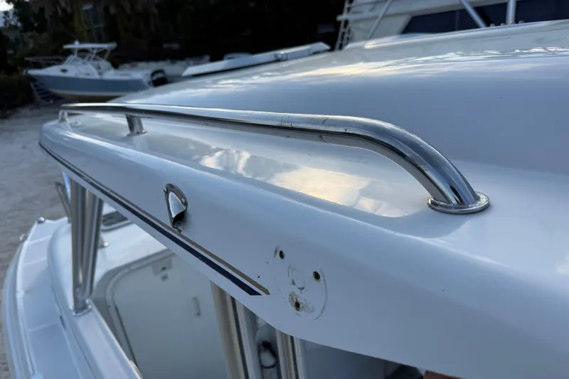 Slide: The Image of Close-up of 2005 Glacier Bay 2680 Coastal Runner boat's sleek metal railing. - 49
