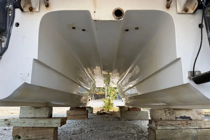 Slide: The Image of 2005 Glacier Bay 2680 Coastal Runner hull on wooden blocks, underside view. - 53