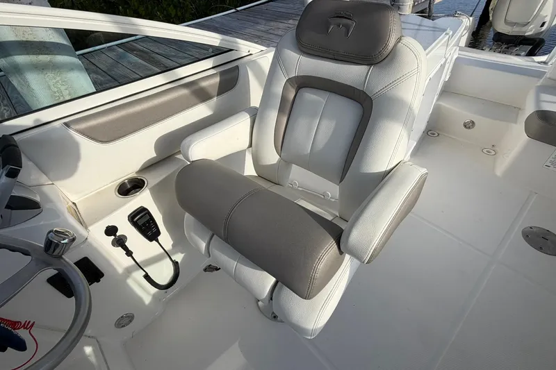 Slide: The Image of Captain's seat on 2020 World Cat 230 SD boat, featuring modern design and controls. - 22