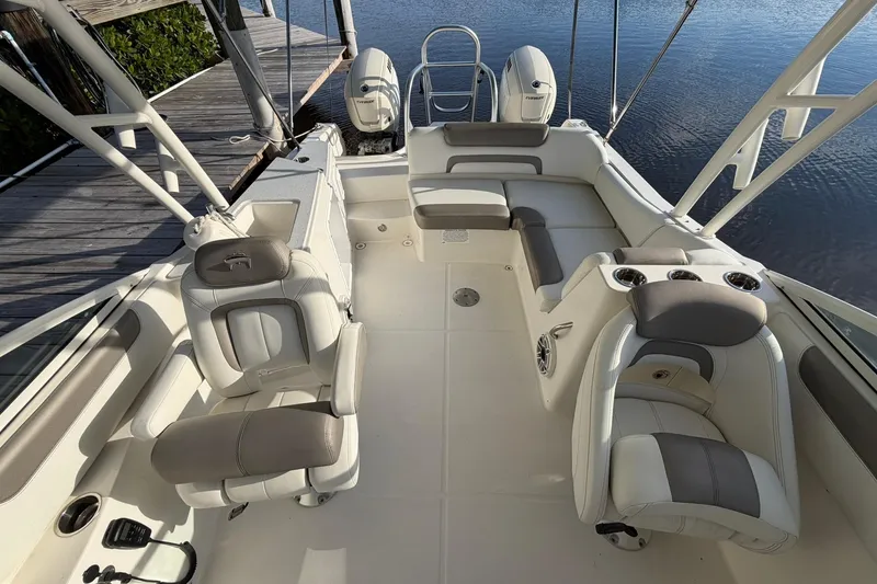 Slide: The Image of Interior of 2020 World Cat 230 SD boat with seating and cup holders. - 23