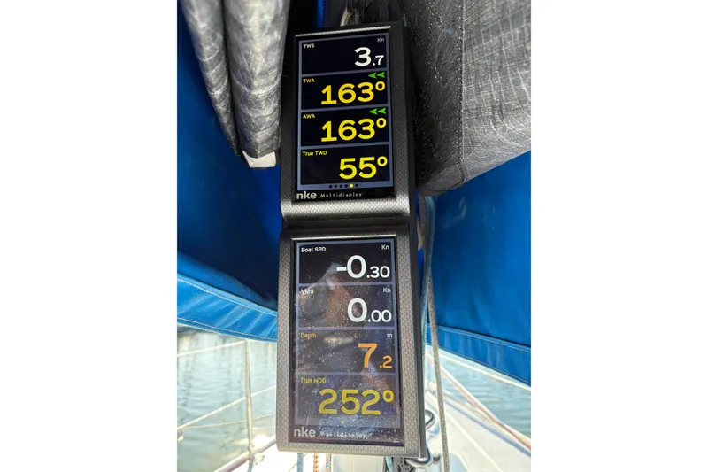 Slide: The Image of Sailing instruments on a 2006 J Boats J/100, displaying wind and speed data. - 13