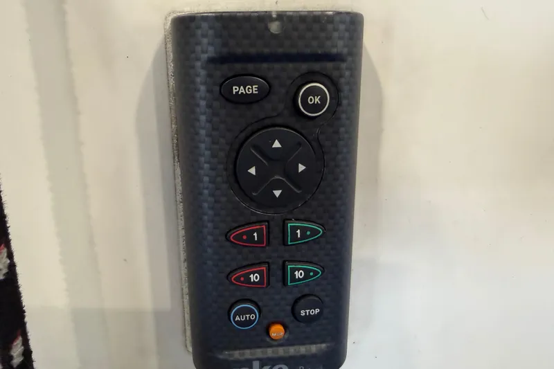 Slide: The Image of Remote control with navigation buttons, featuring carbon fiber texture, for J Boats J/100 model, 2006. - 14