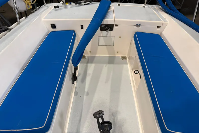 Slide: The Image of 2006 J Boats J/100 cockpit with blue cushioned seating and steering controls. - 22