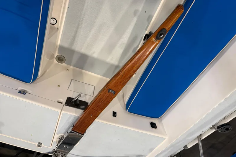 Slide: The Image of 2006 J Boats J/100 cockpit with blue cushions and wooden tiller. - 23