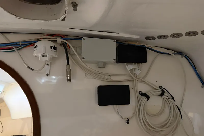 Slide: The Image of 2006 J Boats J/100 interior wiring and equipment setup with cables and connectors. - 33