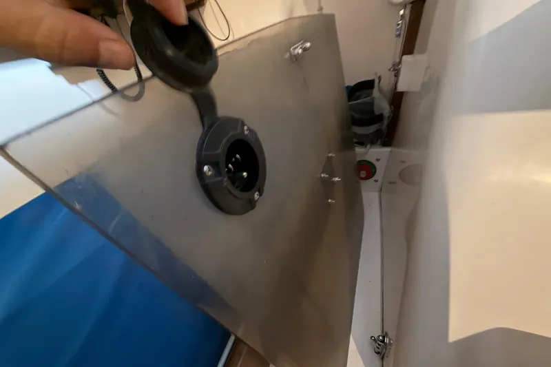 Slide: The Image of 2006 J Boats J/100 interior detail with electrical connection and storage area. - 36