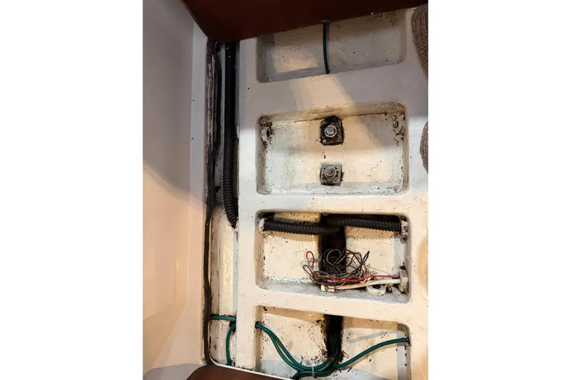 Slide: The Image of 2006 J Boats J/100 interior wiring and compartments, showcasing boat's structural details. - 37