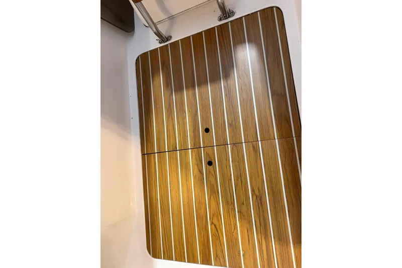 Slide: The Image of Teak deck detail on 2006 J Boats J/100 sailboat, showcasing elegant wood finish. - 38