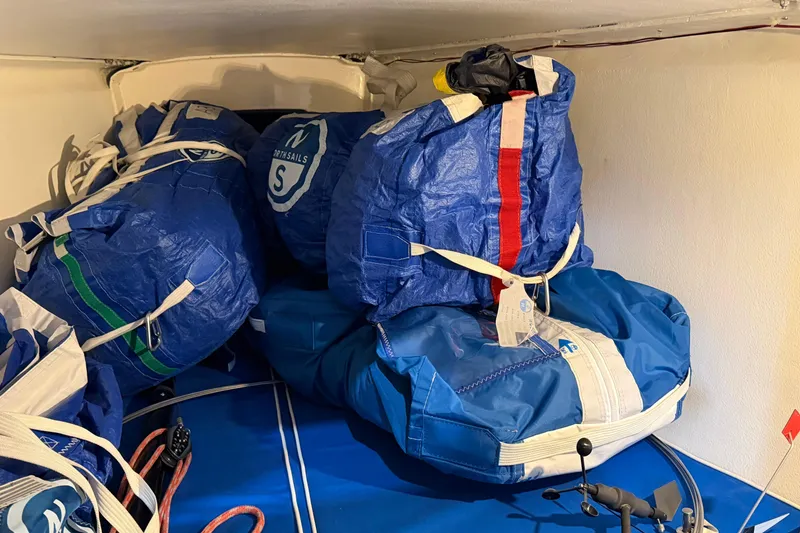Slide: The Image of Blue sail bags stored inside a 2006 J Boats J/100 sailboat. - 41