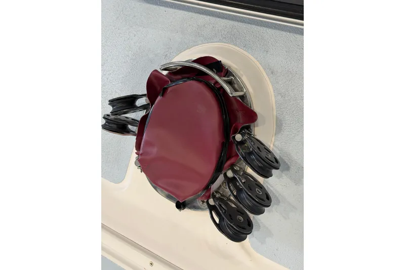 Slide: The Image of Close-up of a 2006 J Boats J/100 sailboat winch with maroon cover. - 43