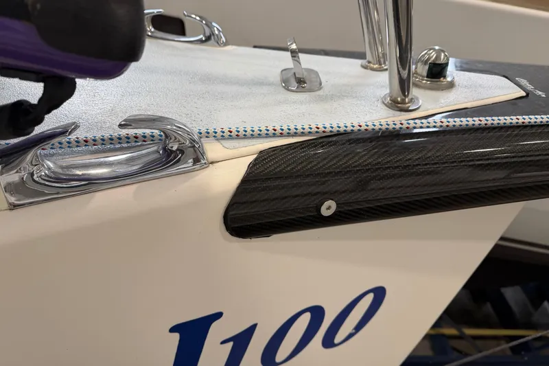 Slide: The Image of 2006 J Boats J/100 sailboat deck with cleat and carbon fiber detail. - 53