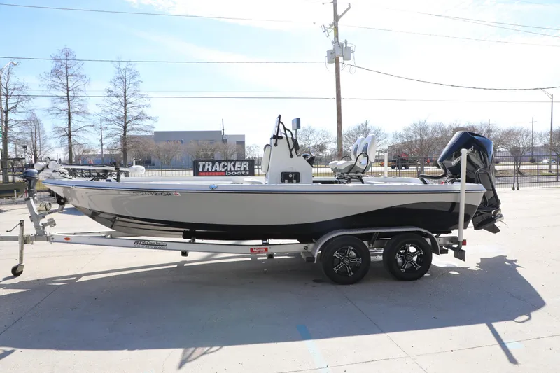 Slide: The Image of 2019 BLUEWAVE Purebay 220 boat on trailer, parked outdoors. - 10