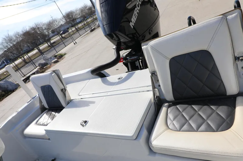 Slide: The Image of 2019 BLUEWAVE Purebay 220 boat seats with diamond-pattern upholstery and Mercury engine. - 5