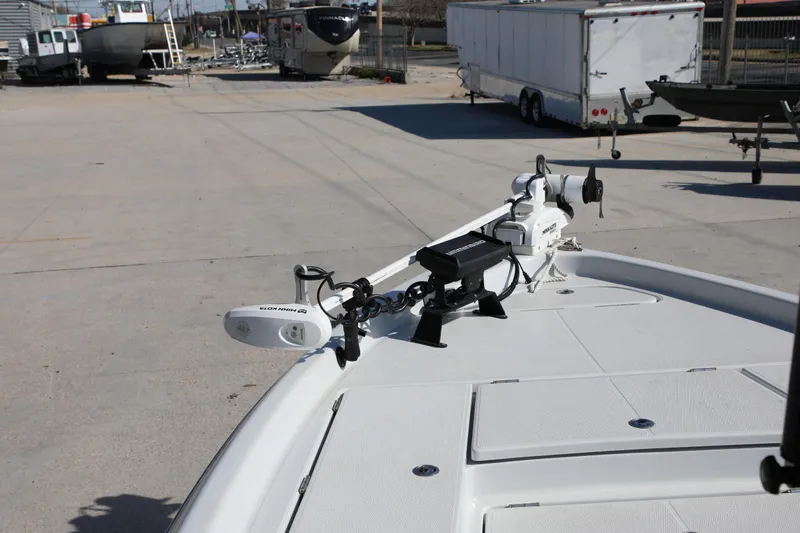 Slide: The Image of 2019 BLUEWAVE Purebay 220 boat with advanced navigation equipment in a marina setting. - 7