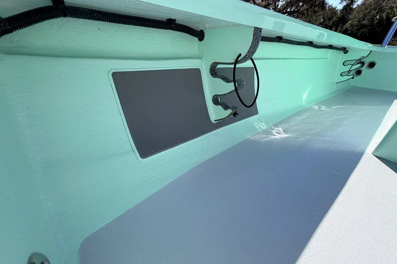 Slide: The Image of 2011 Hell's Bay Glades Skiff interior, showcasing clean design and functional layout. - 27