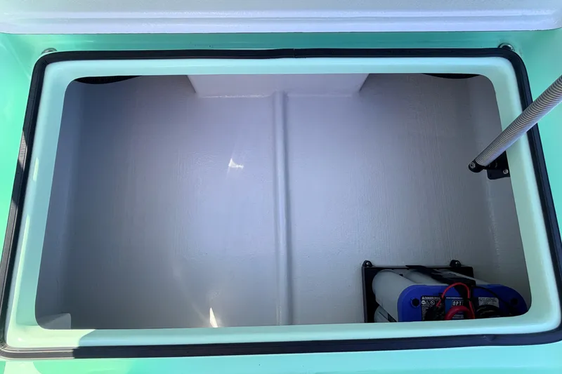 Slide: The Image of 2011 Hell's Bay Glades Skiff storage compartment with battery and wiring. - 40