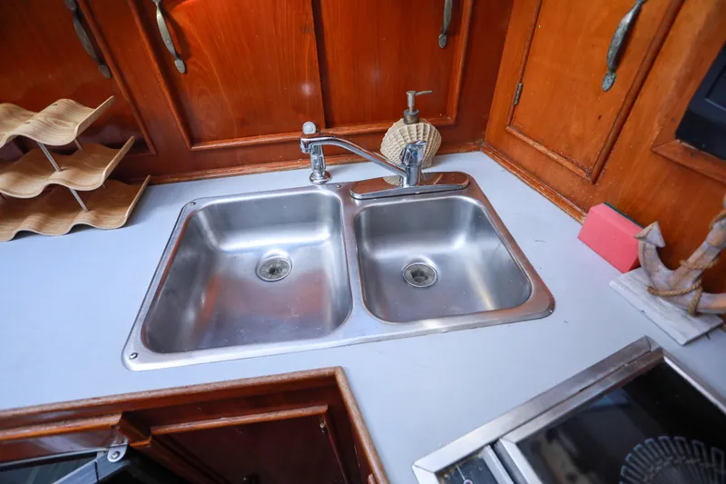 Slide: The Image of Stainless steel double sink in a 1987 Mediterranean 38 yacht kitchen. - 21