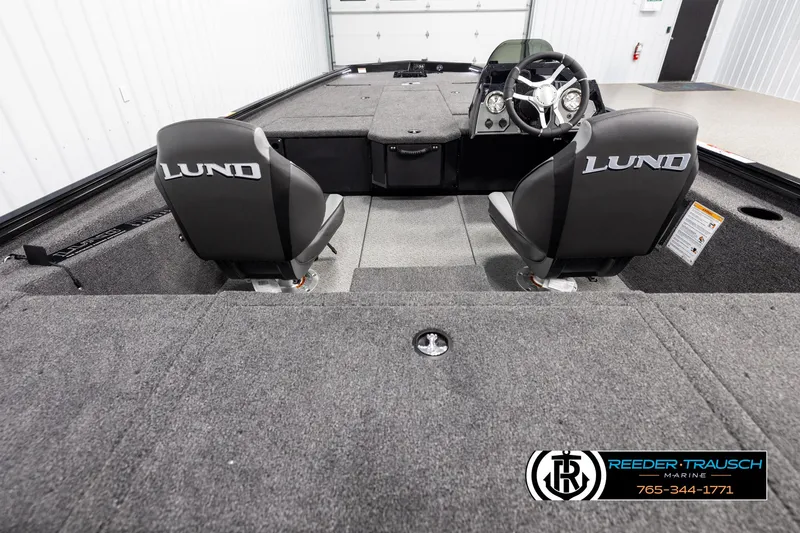 Slide: The Image of 2025 Lund 1975 Renegade boat interior with dual seats and steering console. - 11