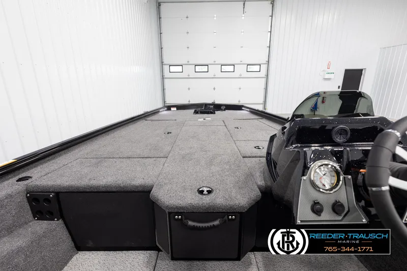 Slide: The Image of 2025 Lund 1975 Renegade boat interior with spacious deck and modern dashboard. - 13