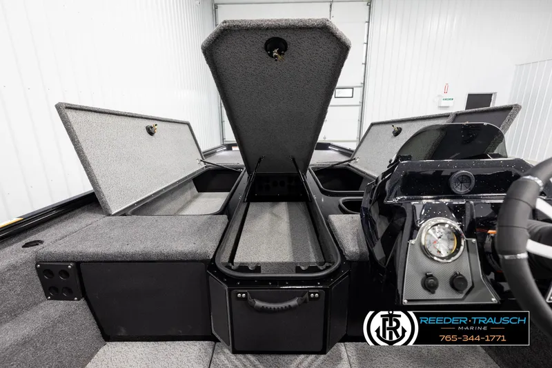 Slide: The Image of Interior view of 2025 Lund 1975 Renegade boat with open storage compartments. - 14