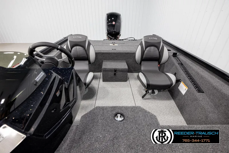 Slide: The Image of 2025 Lund 1975 Renegade boat interior with dual seats and steering console. - 16