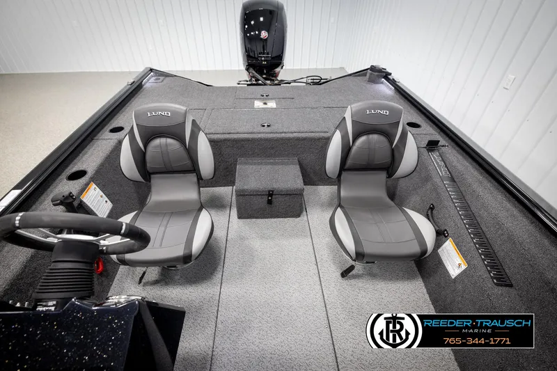 Slide: The Image of Interior of 2025 Lund 1975 Renegade boat with dual seats and steering wheel. - 23