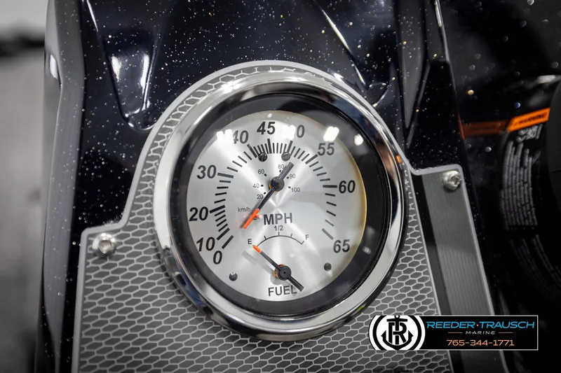 Slide: The Image of Close-up of Lund 1975 Renegade 2025 speedometer and fuel gauge, Reeder-Trausch Marine branding. - 29