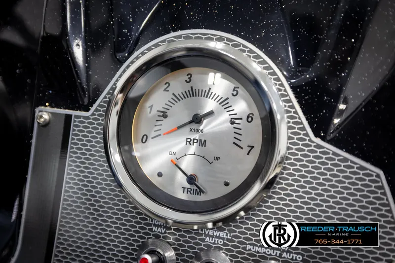 Slide: The Image of Close-up of 2025 Lund 1975 Renegade RPM gauge with trim indicator. - 30