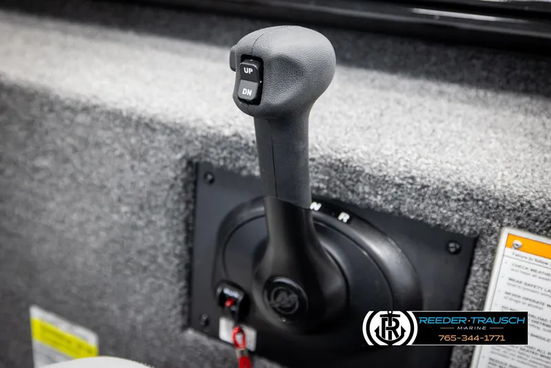 Slide: The Image of Close-up of a 2025 Lund 1975 Renegade boat throttle control. - 32