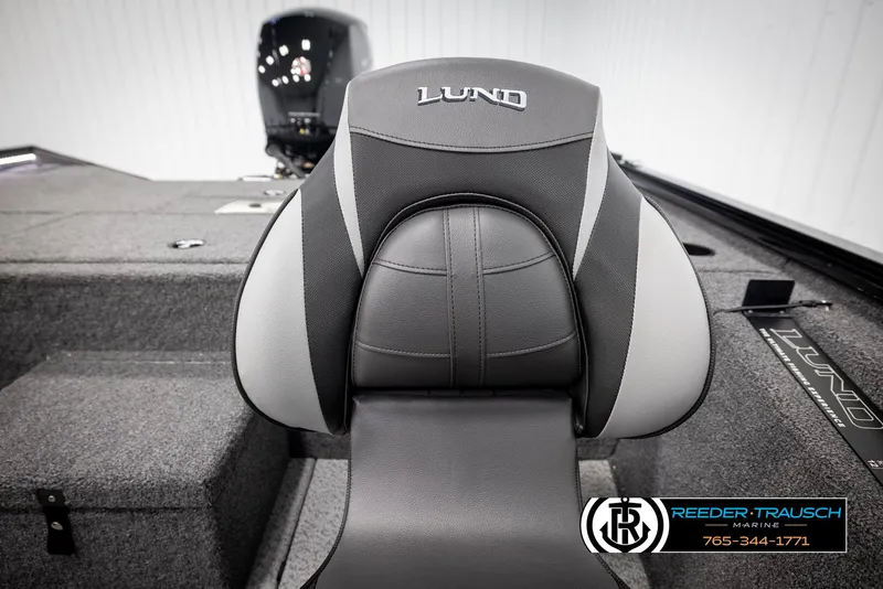 Slide: The Image of 2025 Lund 1975 Renegade boat seat with logo, featuring sleek gray and black design. - 33
