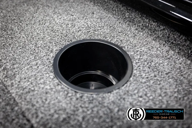 Slide: The Image of Carpeted boat floor with cup holder, Lund 1975 Renegade 2025 model, Reeder-Trausch Marine logo. - 35