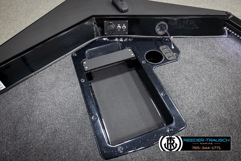 Slide: The Image of Interior of 2025 Lund 1975 Renegade boat with storage compartment and control panel. - 36