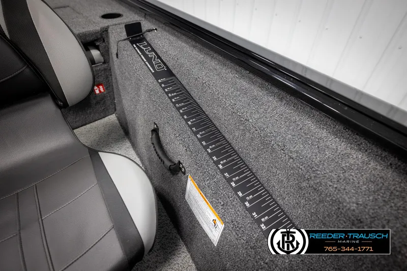 Slide: The Image of 2025 Lund 1975 Renegade boat interior with measuring ruler and seat detail. - 40